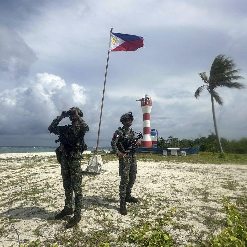 Filipino forces and villagers struggle to live in China's shadow in disputed waters